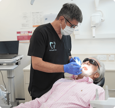 Dentist By The Green team with patient conversation