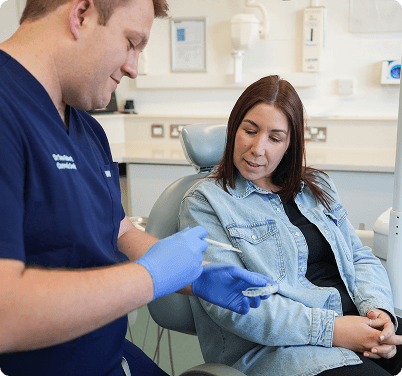 Dentist By The Green team working at the reception desk