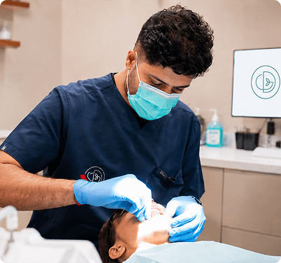 Dentist By The Green team smiling with patient