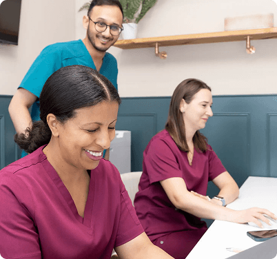 Dentist By The Green team and patient meeting