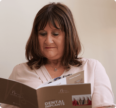 Regent Dental patient reading printed information